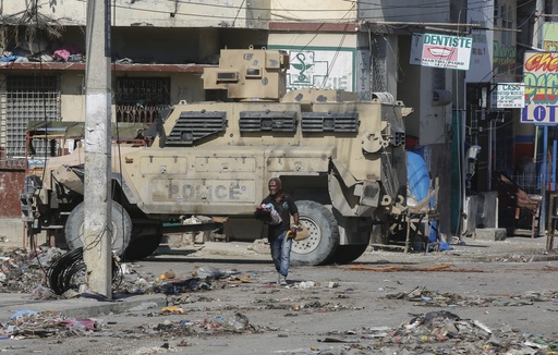 An armored police car patrols the General Hospital area, in Port-au-Prince, Haiti, Tuesday, April 2, 2024. (AP Photo/Odelyn Joseph)