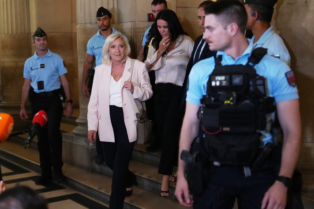 Far-right leader Marine Le Pen leaves the courtroom after the verdict of her appeal trial, in Paris, France, Tuesday, July. 7, 2026. (AP Photo/Aurelien Morissard)