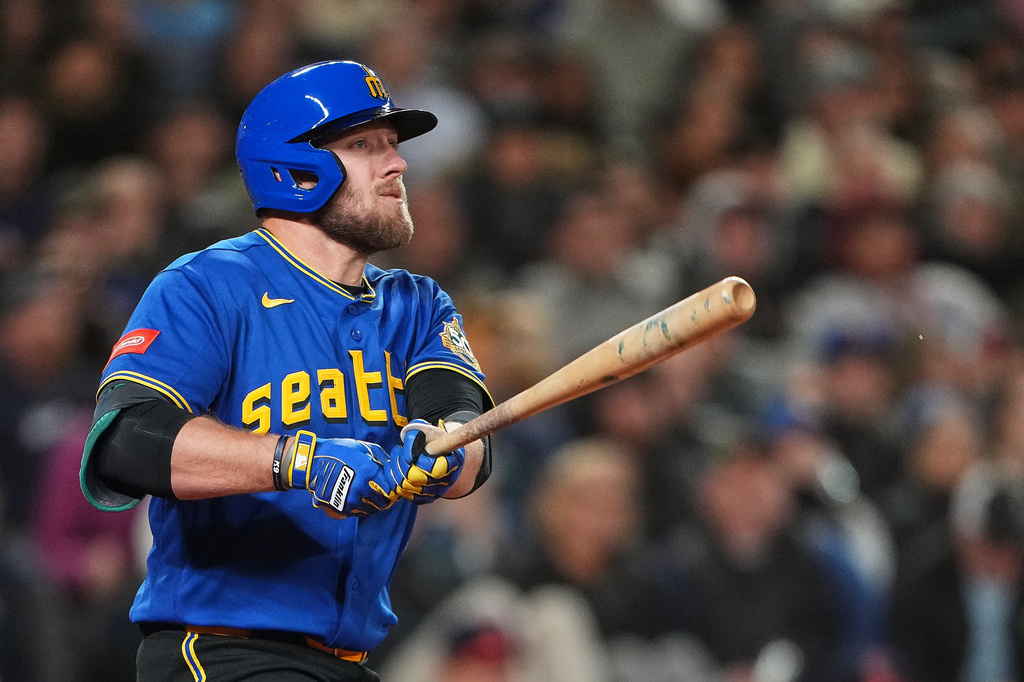 Seattle Mariners' Luke Raley follows through on a two-run home run against the Cleveland Guardians during the sixth inning of a baseball game, Friday, March 27, 2026, in Seattle. (AP Photo/Lindsey Wasson)