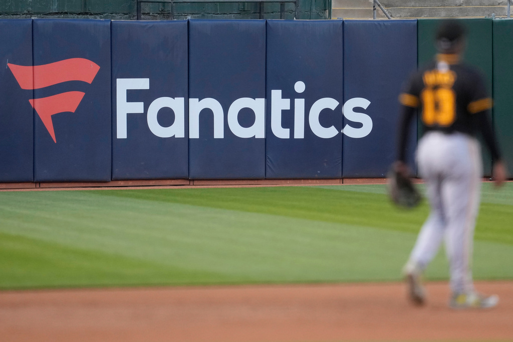 A Fanatics sign is displayed behind Pittsburgh Pirates' Ke'Bryan Hayes during a baseball game between the Oakland Athletics and the Pirates in Oakland, Calif., on April 30, 2024. (AP Photo/Jeff Chiu)