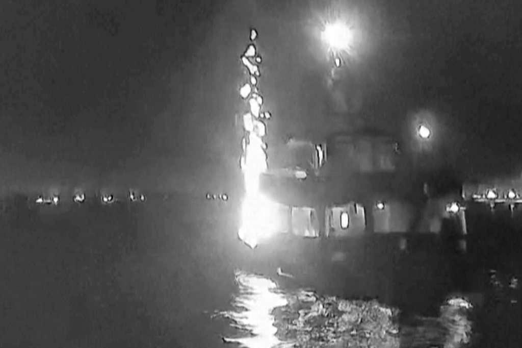 In this image made from video, a vessel known as the “Family Boat” carrying members of an activist group seeking to deliver aid to Gaza, is hit by an object on Tuesday, Sept. 9, 2025, while docked in Tunisia. (Global Sumud Flotilla via AP)