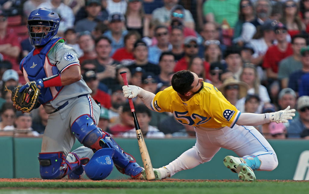 Boston Red Sox batter Wilyer Abreu ducks out of the way of a pitch in the seven inning of a baseball game against the Texas Rangers, Saturday June 13, 2026 in Boston. (AP Photo/Jim Davis)