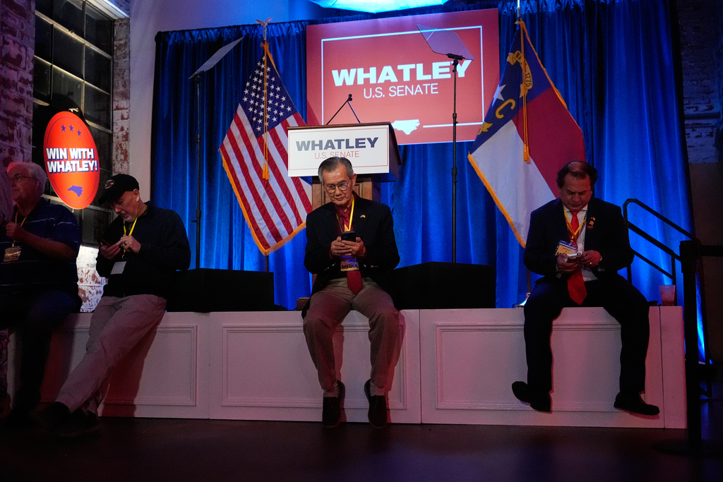 People attend the primary election night watch party for former RNC Chairman Michael Whatley, a Republican candidate for the U.S. Senate, Tuesday, March 3, 2026, in Charlotte, N.C. (AP Photo/Erik Verduzco)