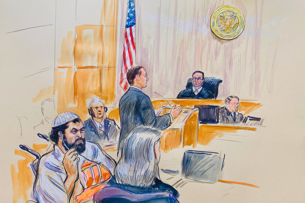 FILE - This courtroom sketch depicts Rahmanullah Lakanwal, 29, seated left, with defense attorney Michelle Peterson, seated foreground, before U.S. District Judge Amit Mehta, Feb. 4, 2025 at Federal Court in Washington, as Assistant U.S. Attorney Christopher Tortorice speaks at the podium. (Dana Verkouteren via AP)