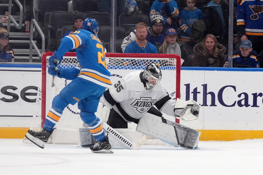 Los Angeles Kings goaltender Darcy Kuemper (35) stops a shot by St. Louis Blues' Jimmy Snuggerud (21) during a shootout of an NHL hockey game Saturday, Jan. 24, 2026, in St. Louis. (AP Photo/Jeff Roberson)