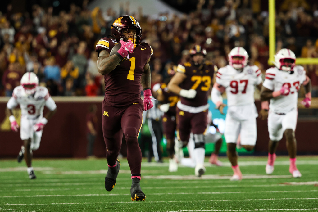 Minnesota running back Darius Taylor (1) runs for a gain during the first half of an NCAA college football game against Nebraska, Friday, Oct. 17, 2025, in Minneapolis. (AP Photo/Ellen Schmidt)