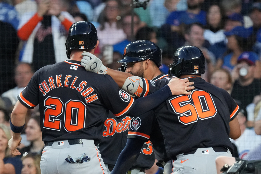 Detroit Tigers' Hao-Yu Lee, of Taiwan, right, is greeted by Spencer Torkelson, left, after hitting a three-run homer against the Chicago Cubs during the fourth inning of a baseball game Wednesday, July 22, 2026, in Chicago. (AP Photo/David Banks)
