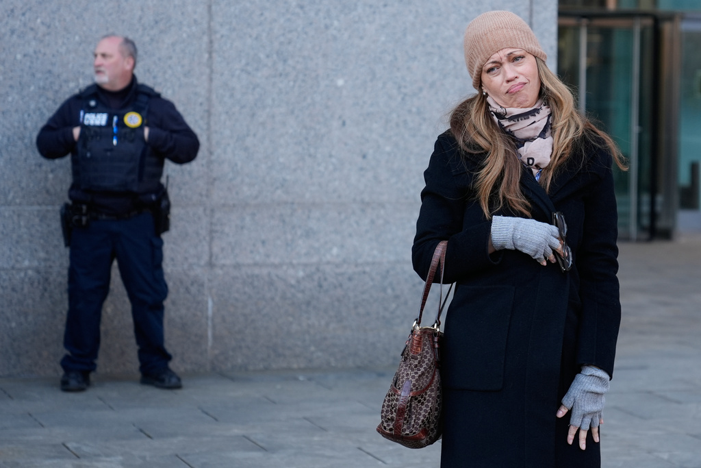 Drew Dixon talks to a fan before entering the courthouse in New York, Monday, Jan. 12, 2026. (AP Photo/Seth Wenig)