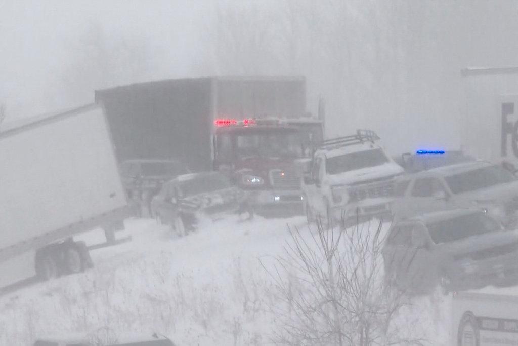 This image taken from video provided by WZZM shows part of a severe multi-car pileup leading Michigan State Police to shut down an interstate south of Grand Rapids Monday, Jan. 19, 2026, in Ottawa County, Mich. (WZZM via AP)