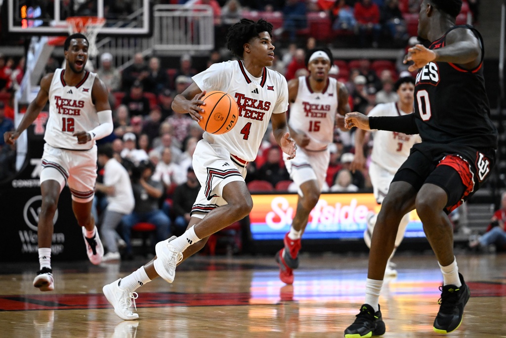 Texas Tech guard Christian Anderson (4) brings the ball up court against Utah during the first half of an NCAA college basketball game Wednesday, Jan. 14, 2026, in Lubbock, Texas. (AP Photo/Justin Rex)