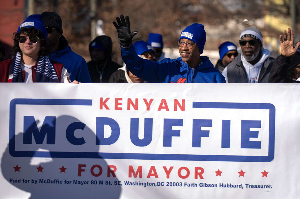FILE - Washington mayoral candidate Kenyan McDuffie, right, walks during the District of Columbia's annual Martin Luther King Day parade on Jan. 19, 2026, in Washington. (AP Photo/Mark Schiefelbein, File)