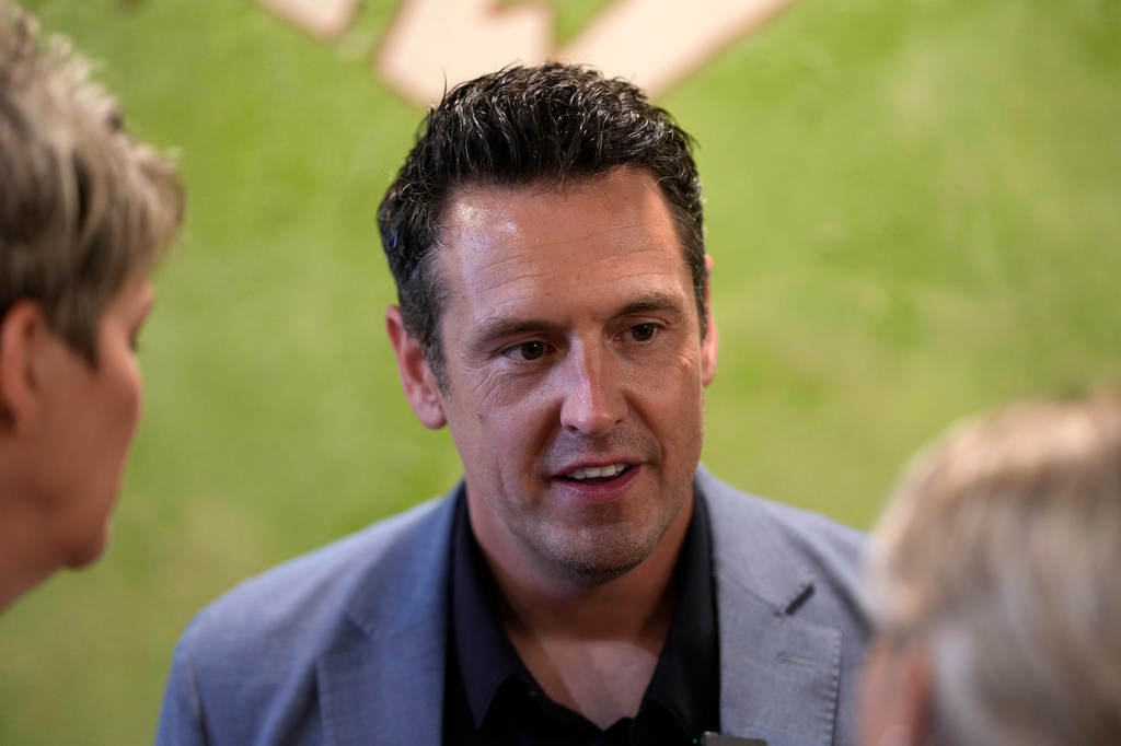 Zach Lahn, Republican candidate for Iowa governor, speaks to local residents during a meet and greet, Tuesday, Aug. 4, 2026, in Hampton, Iowa. (AP Photo/Charlie Neibergall)