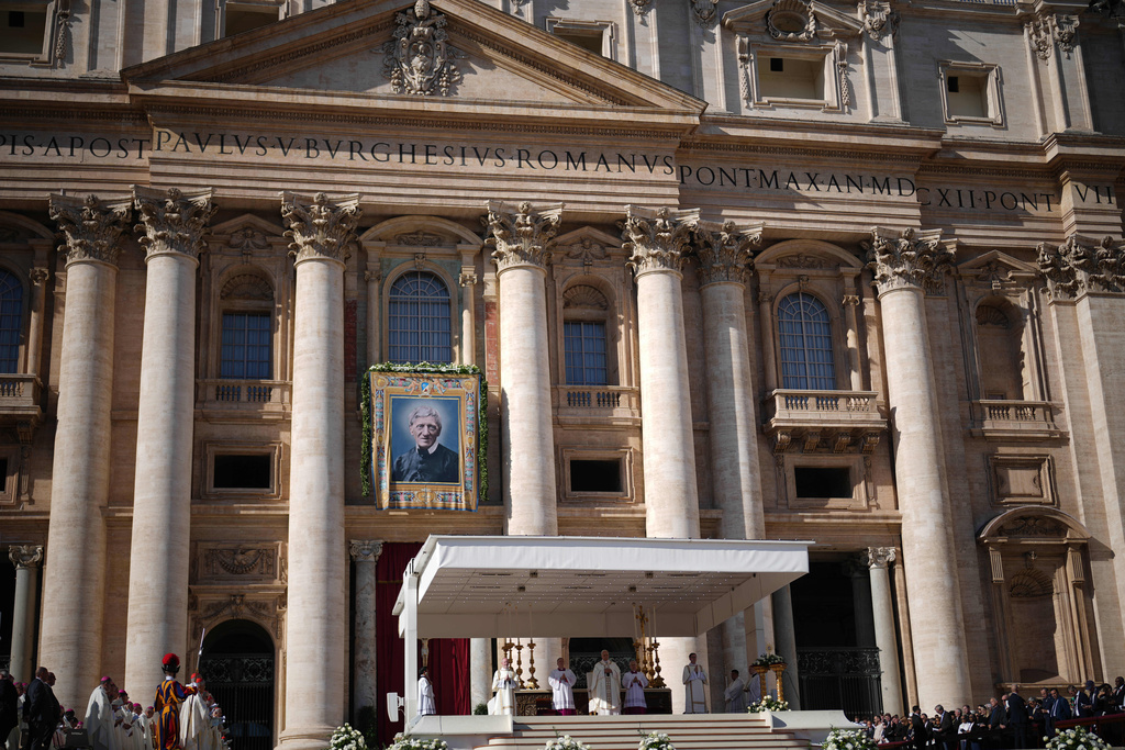Pope Leo XIV presides over Mass with participants in the Jubilee of the Educational World on the Solemnity of All Saints, in St. Peter's Square, at the Vatican, Saturday, Nov. 1, 2025, during which he will proclaim St. John Henry Newman a Doctor of the Church. (AP Photo/Andrew Medichini)