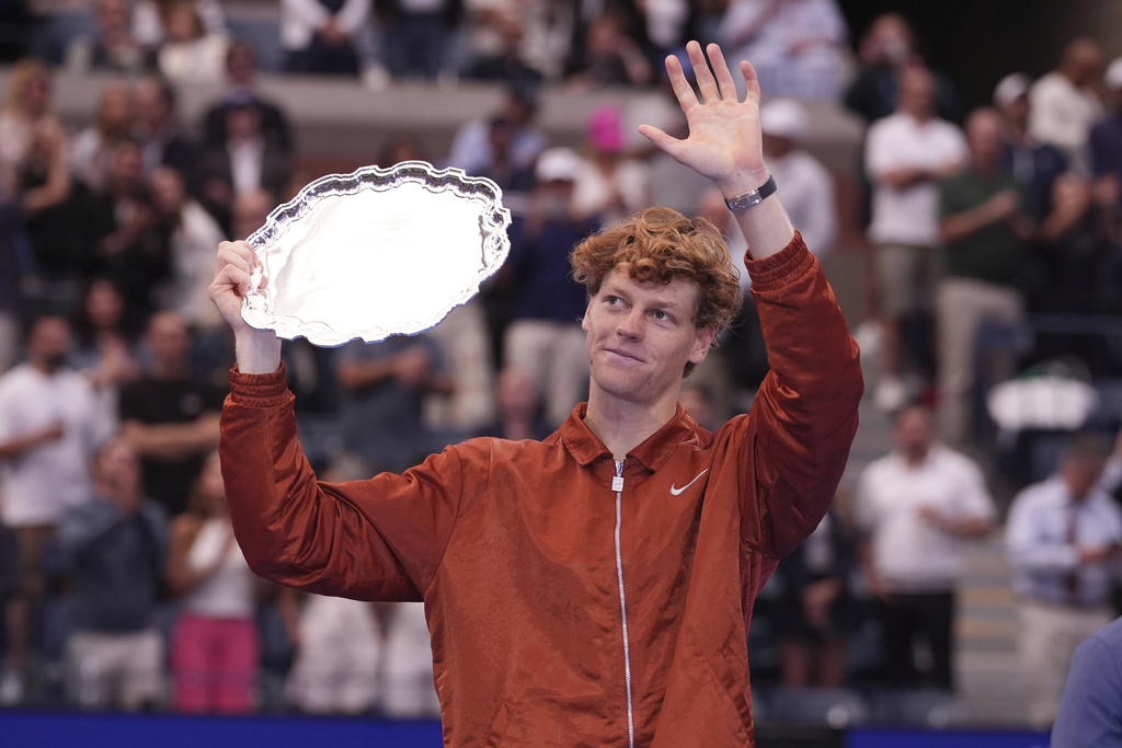Jannik Sinner, of Italy, lifts his trophy after losing to Carlos Alcaraz, of Spain, in the men's singles final of the U.S. Open tennis championships, Sunday, Sept. 7, 2025, in New York. (AP Photo/Frank Franklin II)