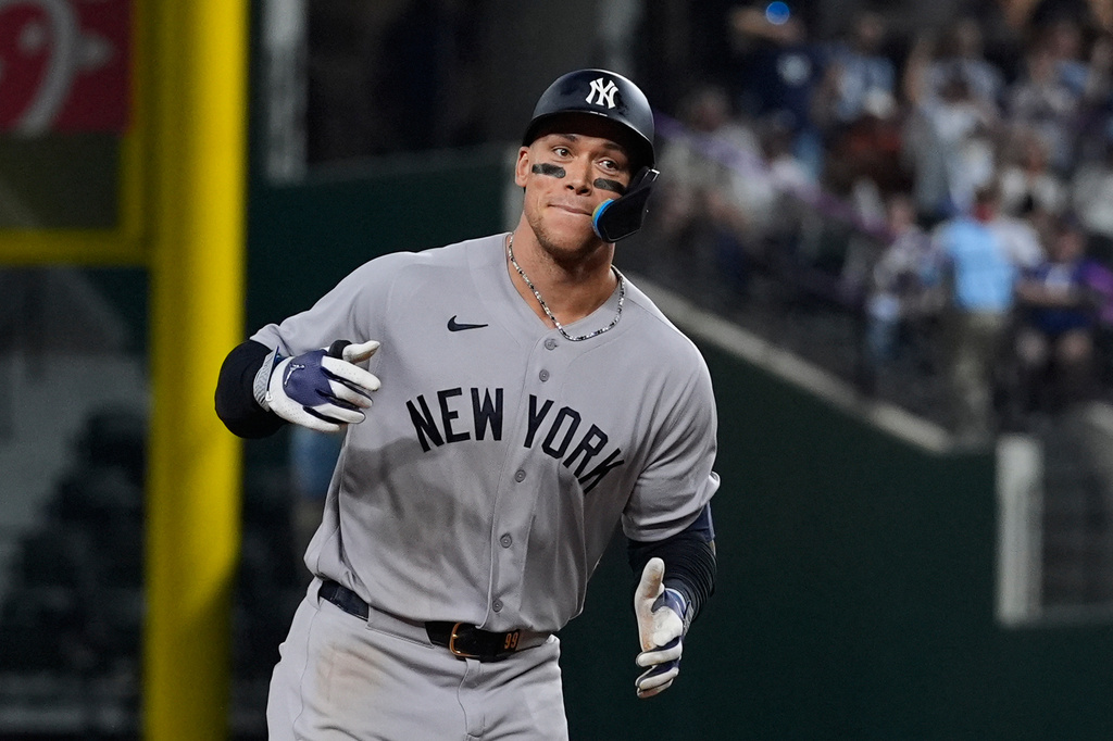 New York Yankees' Aaron Judge rounds the bases after hitting a solo home run off of Texas Rangers relief pitcher Cole Winn in the ninth inning of a baseball game Tuesday, April 28, 2026, in Arlington, Texas. (AP Photo/Tony Gutierrez)