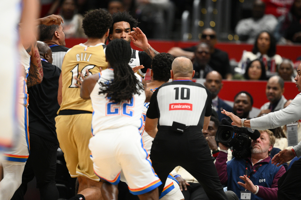 Members of the Oklahoma City Thunder and the Washington Wizards scuffle during the first half of an NBA basketball game, Saturday, March 21, 2026, in Washington. (AP Photo/Nick Wass)