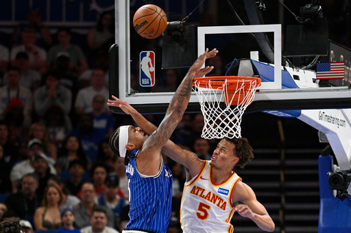 Orlando Magic forward Paolo Banchero, left, is fouled by Atlanta Hawks guard Dyson Daniels (5), while going up to dunk during the first half of an NBA basketball game Friday, Oct. 24, 2025, in Orlando, Fla. (AP Photo/Phelan M. Ebenhack) Orlando Magic forward Paolo Banchero, left, is fouled by Atlanta Hawks guard Dyson Daniels (5), while going up to dunk during the first half of an NBA basketball game Friday, Oct. 24, 2025, in Orlando, Fla. (AP Photo/Phelan M. Ebenhack)