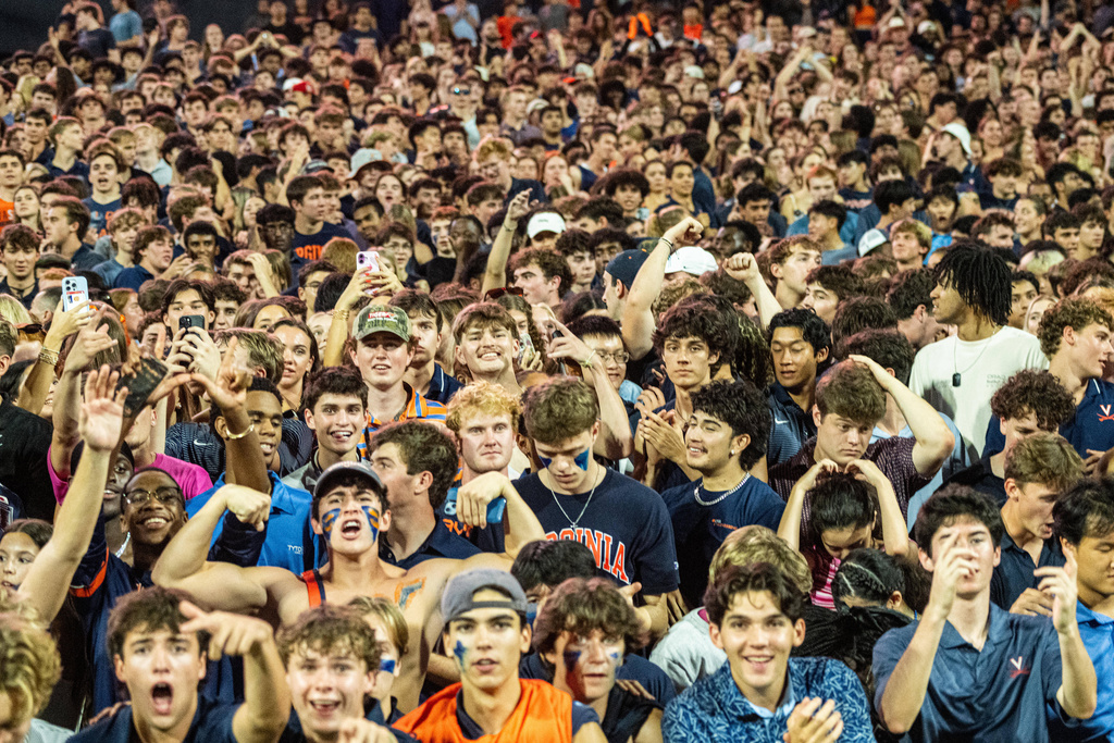 Virginia Fans take the field after overtime win over Florida State of an NCAA college football game, Friday, Sept. 26 2025, in Charlottesville, Va. (AP Photo/Robert Simmons)