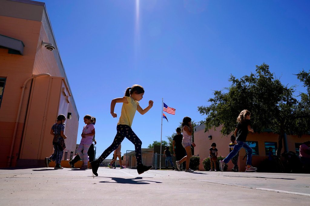 FILE - Whittier Elementary School students enjoy recess, Tuesday, Oct. 18, 2022 in Mesa, Ariz. (AP Photo/Matt York,File)