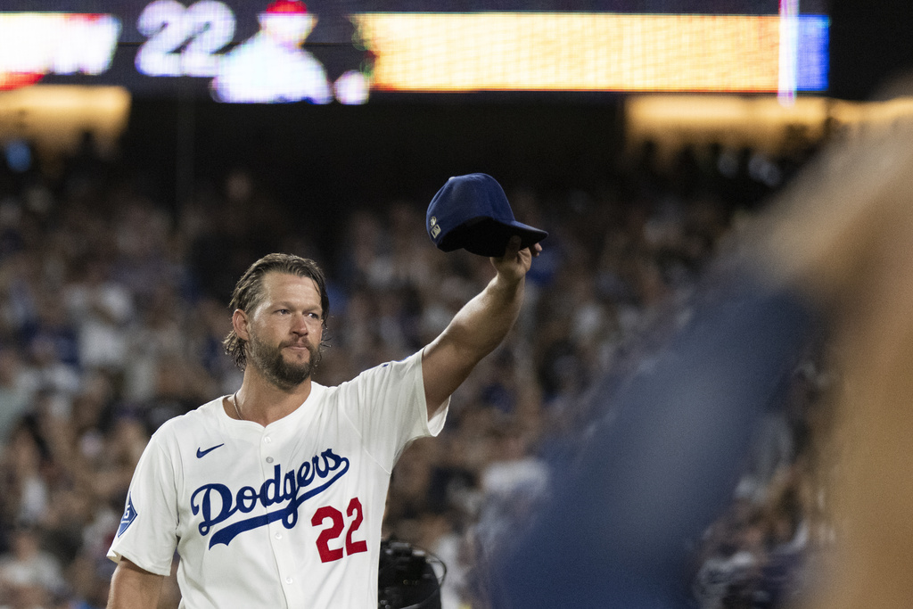 Los Angeles Dodgers starting pitcher Clayton Kershaw (22) tips his hat after being removed during the fifth inning of a baseball game against the San Francisco Giants in Los Angeles, Friday, Sept. 19, 2025. (AP Photo/Kyusung Gong)
