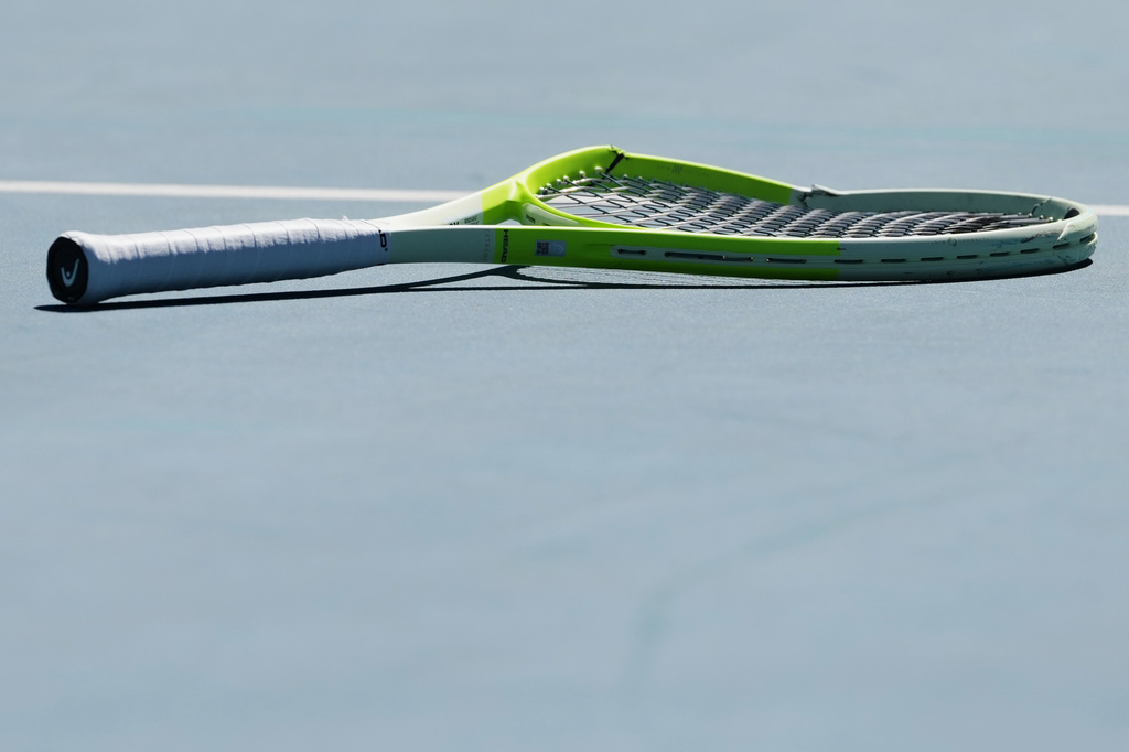 FILE - Alejandro Davidovich Fokina of Spain's racket lies on the court during his second round match against Reilly Opelka of the U.S. at the Australian Open tennis championship in Melbourne, Australia, on Jan. 21, 2026. (AP Photo/Aaron Favila)