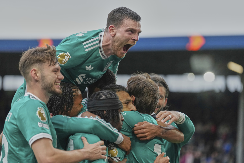 Liverpool players celebrate after a goal during the Premier League soccer match between Burnley and Liverpool in Burnley, England, Sunday, Sept. 14, 2025. (AP Photo/Jon Super)