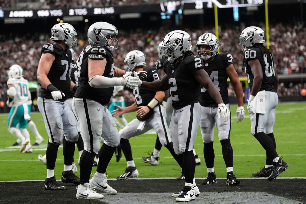 Las Vegas Raiders running back Ashton Jeanty (2) celebrates with teammates after a touchdown reception during the second half of an NFL football game against the Miami Dolphins, Sunday, Sept. 13, 2026, in Las Vegas. (AP Photo/Ross D. Franklin)