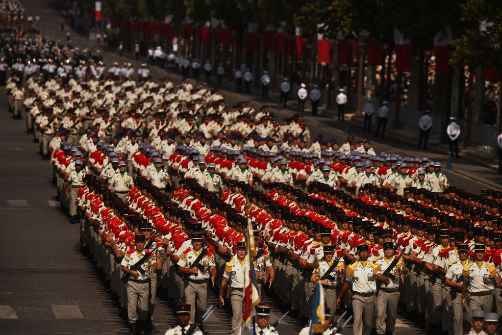 French soldiers march during the Bastille Day military parade on the Champs-Elysees avenue, in Paris, Tuesday, July 14, 2026. (AP Photo/Thomas Padilla)
