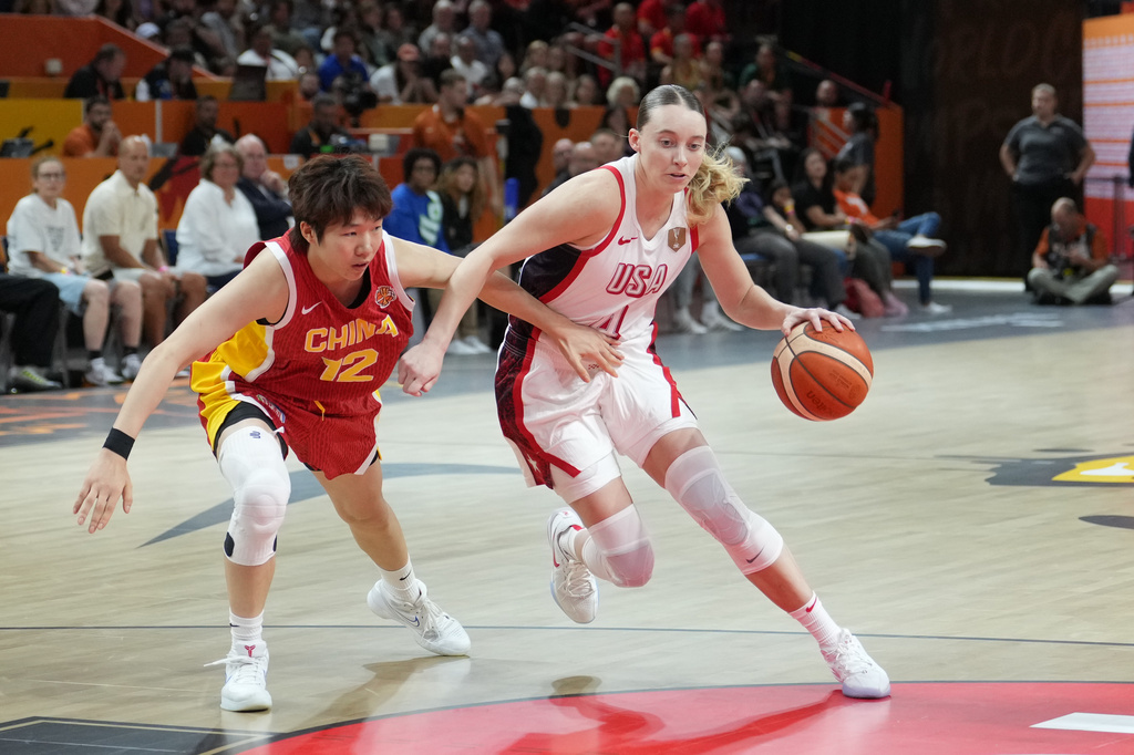 China's Chen Yujie guards United States' Paige Bueckers during the Women's Basketball World Cup match between China and the United States in Berlin, Friday, Sept. 4, 2026. (AP Photo/Ebrahim Noroozi)