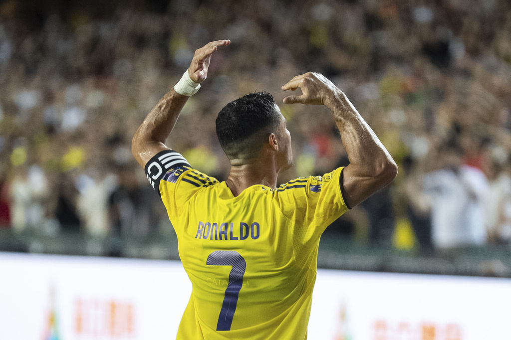 Al Nassr's Cristiano Ronaldo celebrates after scoring a goal with a penalty kick during the Saudi Super Cup final soccer match between Al Ahli and Al Nassr at the Hong Kong Stadium in Hong Kong, Saturday, Aug. 23, 2025. (AP Photo/Chan Long Hei)