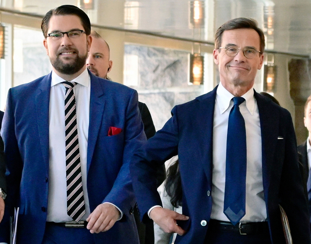 FILE - Jimmie Akesson, leader of the Sweden Democrats Party and Ulf Kristersson, leader of the Moderate Party arrive for a press conference regarding the formation of the government, at the Parliament in Stockholm, on Oct. 14, 2022. (Jonas Ekstromer/TT News Agency via AP, File)