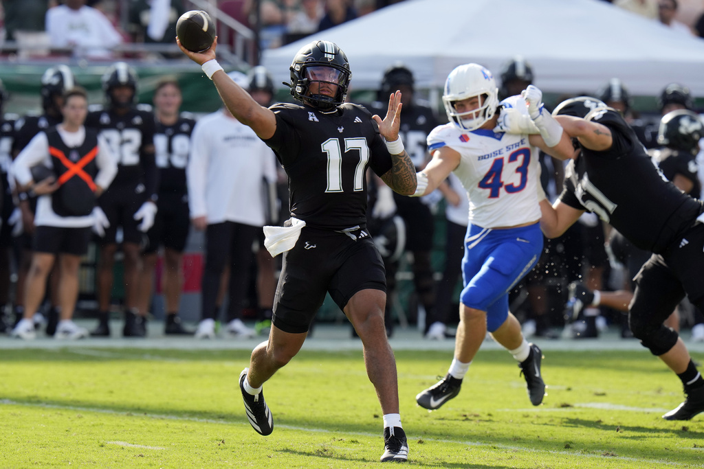 South Florida quarterback Byrum Brown (17) throws a pass in front of Boise State linebacker Jake Ripp (43) during the first half of an NCAA college football game Thursday, Aug. 28, 2025, in Tampa, Fla. (AP Photo/Chris O'Meara)