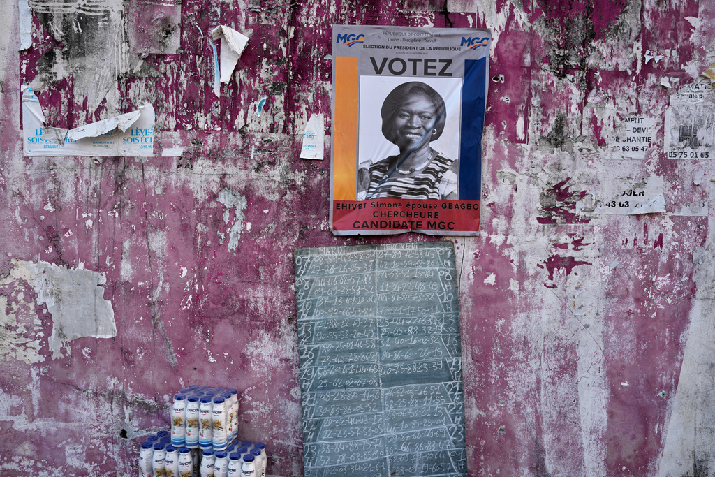 A campaign poster of presidential candidate Simone Gbagbo is pasted on a wall in Abidjan, Ivory Coast, Wednesday, Oct. 22, 2025. (AP Photo/Misper Apawu)