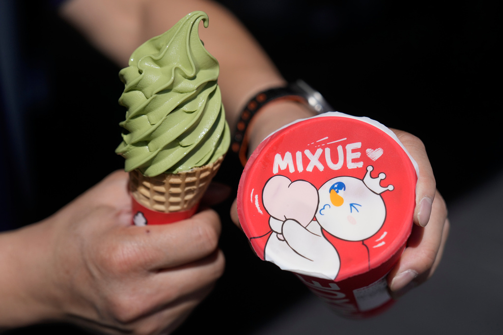A customer holds an ice cream cone outside of a Mixue store, Wednesday, Sept. 16, 2026, in Sunnyvale, Calif. (AP Photo/Jeff Chiu)