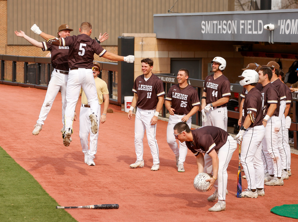FILE - Lehigh catcher Owen Walewander (5) celebrates with his teammates after hitting a three-run home run against Saint Joseph's in the third inning during an NCAA college baseball game, March 31, 2026, in Philadelphia. (AP Photo/Jason E. Miczek, File)