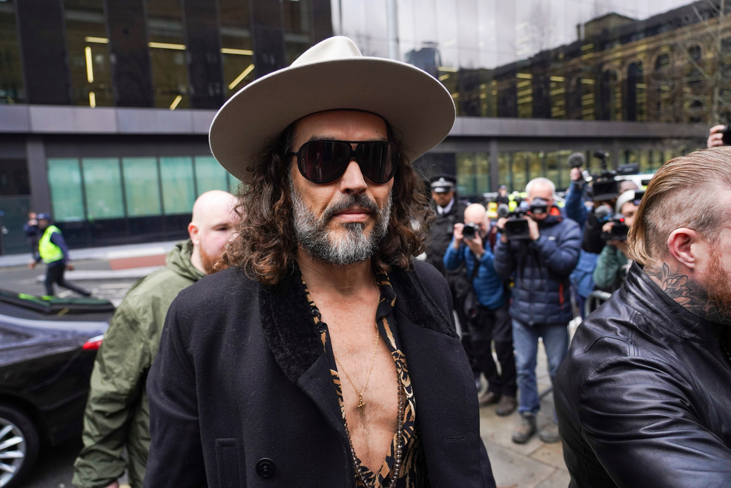 Russell Brand arrives at Southwark Crown Court, in London, Tuesday, Feb. 24, 2026. (AP Photo/Alberto Pezzali)