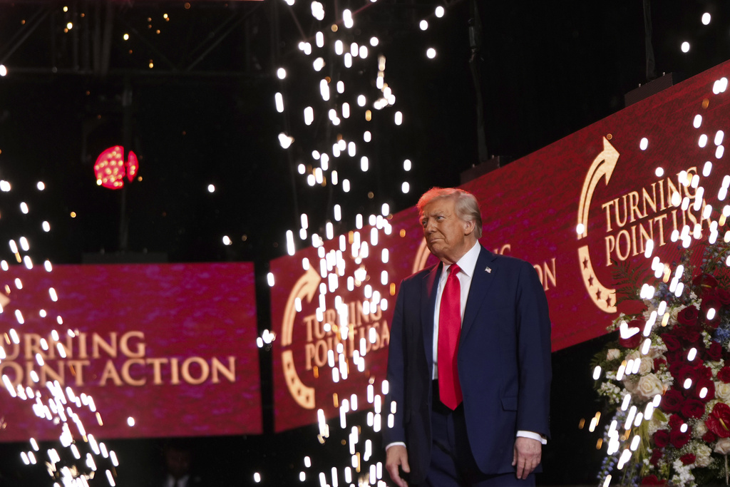 President Donald Trump walks on stage to speak at a memorial for conservative activist Charlie Kirk, Sunday, Sept. 21, 2025, at State Farm Stadium in Glendale, Ariz. (AP Photo/Julia Demaree Nikhinson)