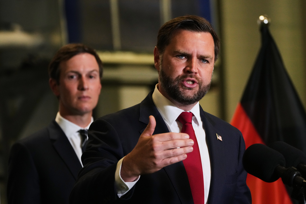 U.S. Vice President JD Vance speak to the media as Jared Kushner looks on, in Kiryat Gat, Israel, Tuesday, Oct. 21, 2025. (AP Photo/Francisco Seco)