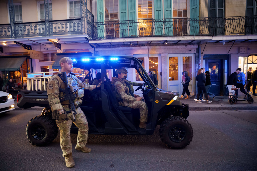 FILE - The Louisiana National Guard, military police, and Louisiana law enforcement agencies patrol the French Quarter along Royal Street as part of a National Guard deployment for New Year's celebrations in New Orleans, Dec. 30, 2025. (AP Photo/Matthew Hinton)