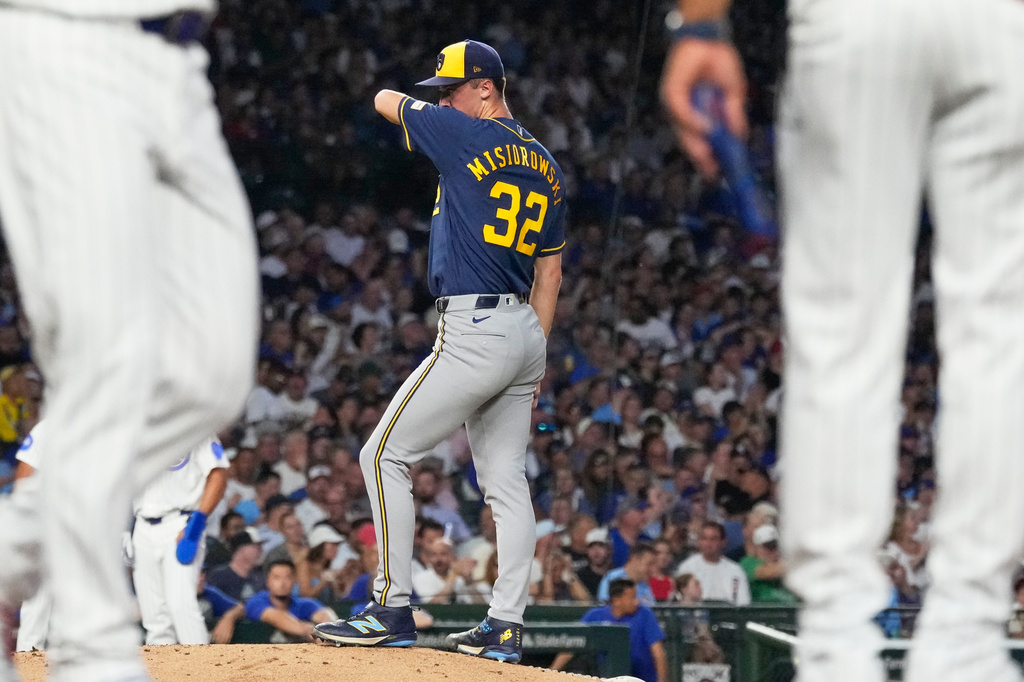 Milwaukee Brewers starting pitcher Jacob Misiorowski wipes his face after Chicago Cubs' Seiya Suzuki of Japan, walked to first during the second inning of a baseball game in Chicago, Wednesday, Sept. 2, 2026. (AP Photo/Nam Y. Huh)