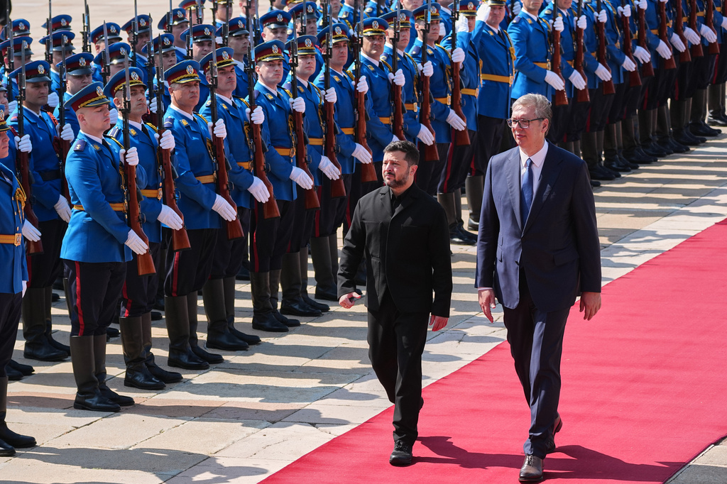 Ukraine's President Volodymyr Zelenskyy reviews an honor guard with his Serbian counterpart Aleksandar Vucic during a welcome ceremony at the Serbia Palace, in Belgrade, Serbia, Saturday, Aug. 8, 2026. (AP Photo/Darko Vojinovic)