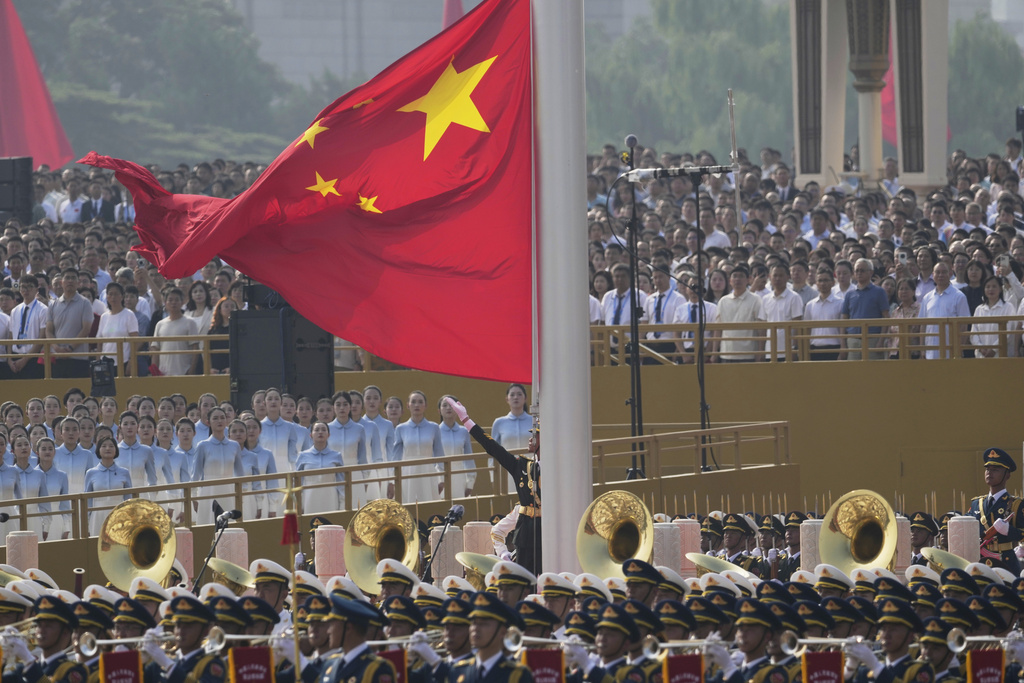 The Chinese flag is raised ahead of a military parade to commemorate the 80th anniversary of Japan's World War II surrender held in front of Tiananmen Gate in Beijing, Wednesday, Sept. 3, 2025. (AP Photo/Ng Han Guan)
