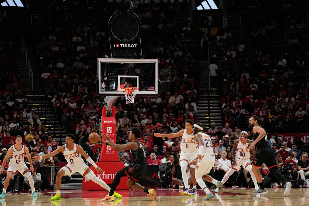 Play continues with the shot clock not working during the first half of an NBA basketball game between the Phoenix Suns and Houston Rockets Monday, Jan. 5, 2026, in Houston. (AP Photo/David J. Phillip)