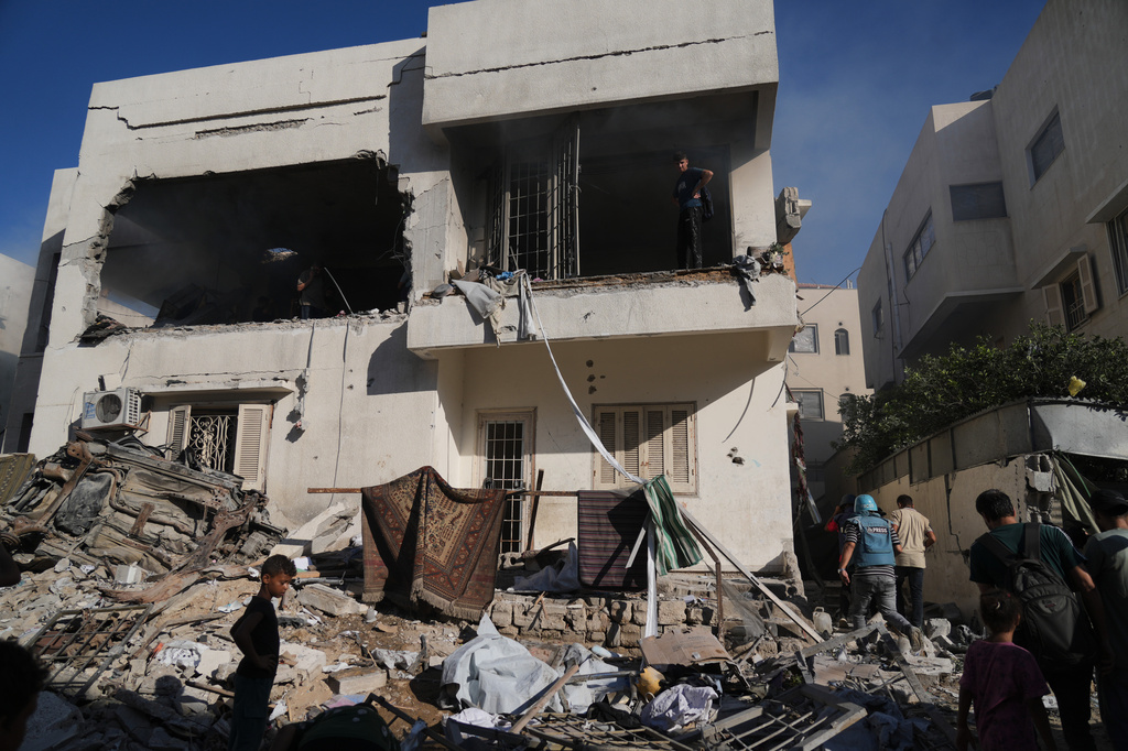 Palestinians inspect a building destroyed by an Israeli airstrike in Gaza City, Tuesday, Sept. 8, 2026. (AP Photo/Jehad Alshrafi)