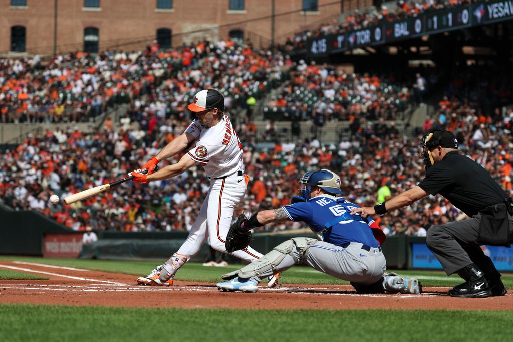 Baltimore Orioles' Gunnar Henderson ground into a force out and reaches first base off of Toronto Blue Jays pitcher Trey Yesavage during the first inning of a baseball game, Saturday, May 30, 2026, in Washington. (AP Photo/Terrance Williams)