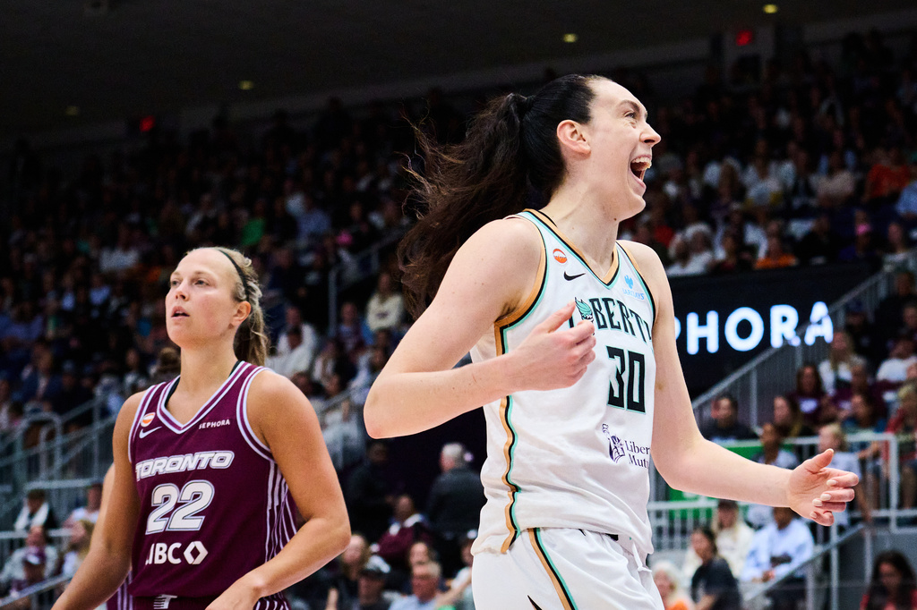 New York Liberty's Breanna Stewart (30) celebrates after scoring past Toronto Tempo's Julie Allemand (22) during the first half of a WNBA basketball game in Toronto, Sunday, Sept. 20, 2026. (Sammy Kogan/The Canadian Press via AP)