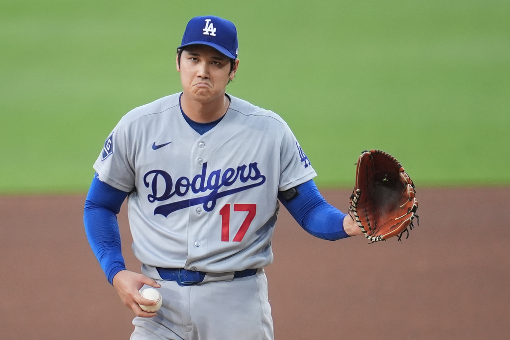 Los Angeles Dodgers starting pitcher Shohei Ohtani gestures as he works against a San Diego Padres batter during the fifth inning of a baseball game Wednesday, May 20, 2026, in San Diego. (AP Photo/Gregory Bull)