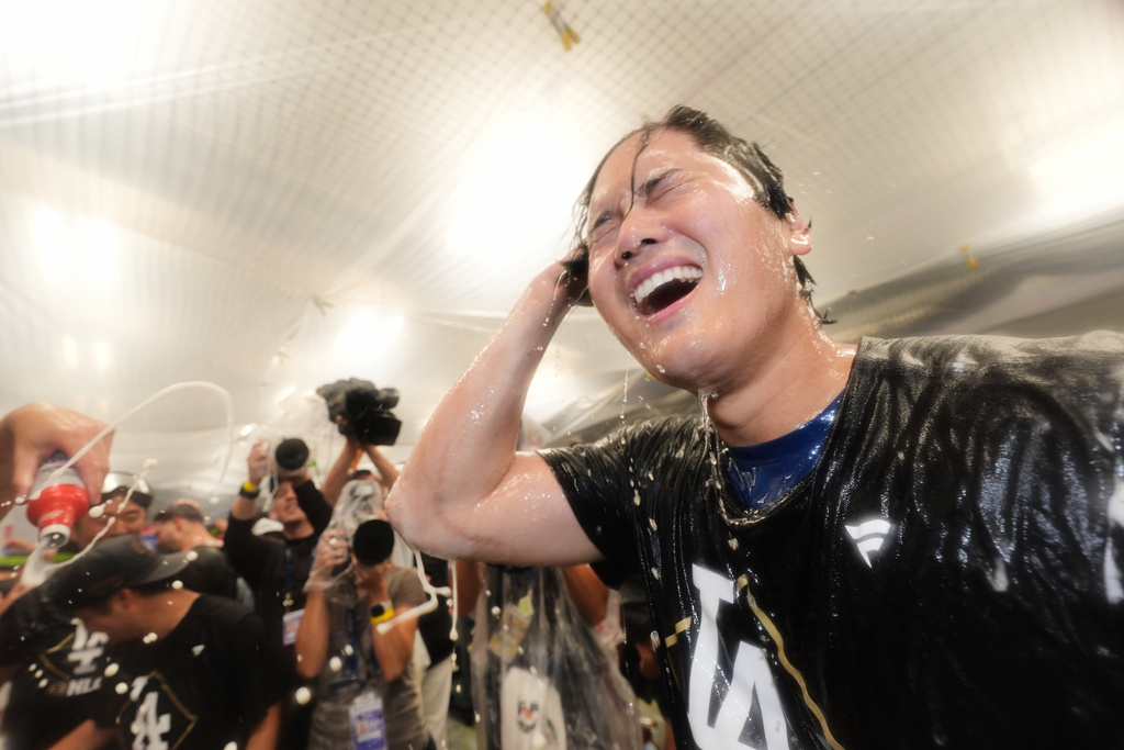 Los Angeles Dodgers' Shohei Ohtani celebrates after his team's win over the Philadelphia Phillies in Game 4 of baseball's National League Division Series Thursday, Oct. 9, 2025, in Los Angeles. (AP Photo/Jae C. Hong)