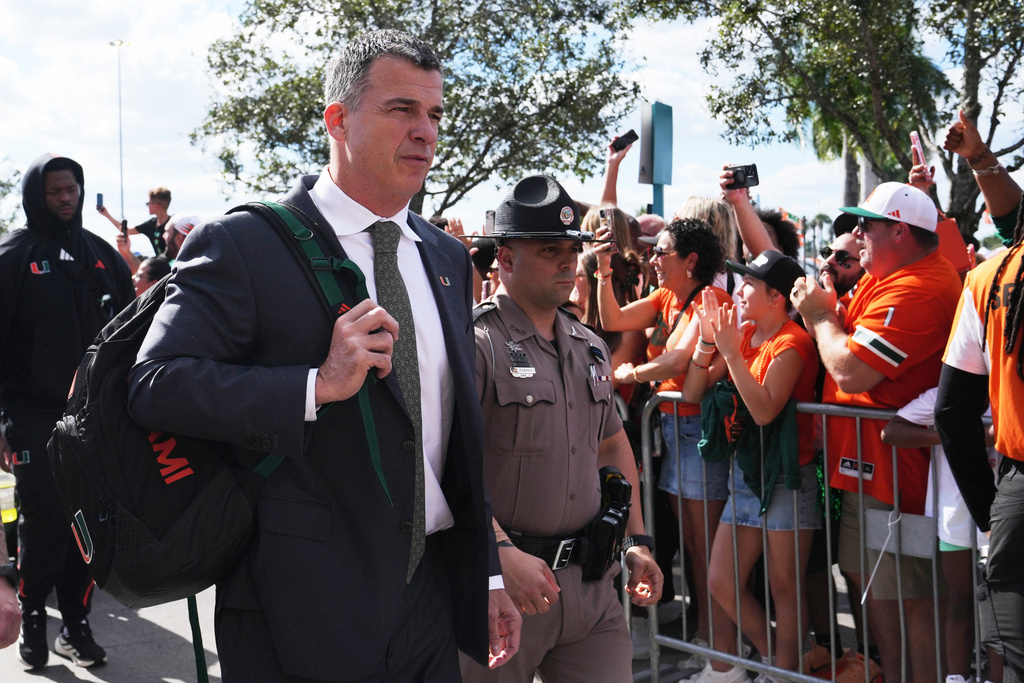 Miami head coach Mario Cristobal arrives before an NCAA college football game against North Carolina State, Saturday, Nov. 15, 2025, in Miami Gardens, Fla. (AP Photo/Lynne Sladky)