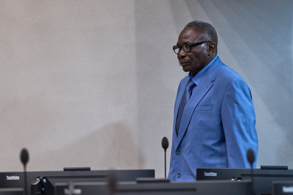 Ali Muhammad Ali Abd al-Rahman, a leader of the Sudanese Janjaweed militia, enters the court room at the International Criminal Court, ICC, in The Hague, Netherlands, Tuesday, Dec. 9, 2025. (AP Photo/Peter Dejong, Pool)